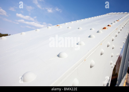 Riveted joints in the iron bridge support structure Stock Photo