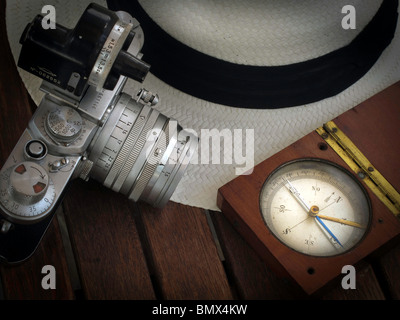 panama hat,compass and old photograph camera Leica  in same composition Stock Photo