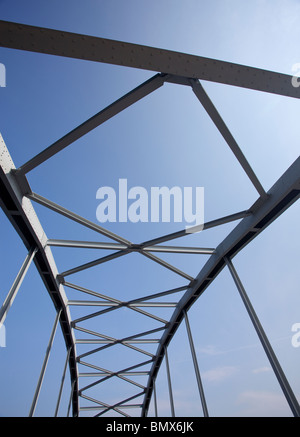 Iron bridge support structure, using riveted steel girders. Stock Photo