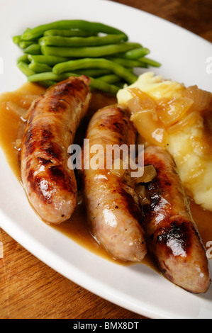Stock photo of a plate of sausages, mashed potatoes, and green beans. Stock Photo