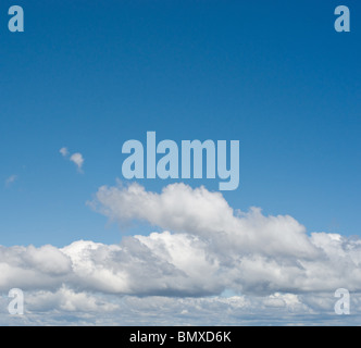 Beautiful white and fluffy clouds in a deep blue sunny sky Stock Photo ...