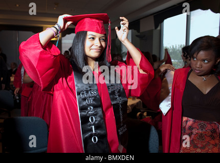 Hispanic female student prepares for her high school graduation ceremony at KIPP Academ in Houston, Texas, USA Stock Photo