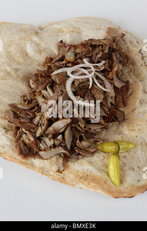 Shawarma shavings in a Lafa - flat Iraqi pita with pickles. A popular fast food in Israel and the Middle East Stock Photo