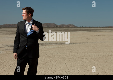 Businessman in desert Stock Photo