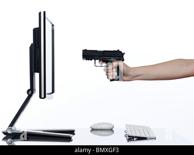communication between human hand and a computer display monitor on isolated white background expressing failure gun shoot concept Stock Photo