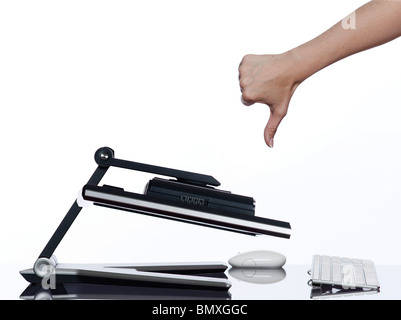 communication between human hand and a computer display monitor on isolated white background expressing thumb down failure concept Stock Photo