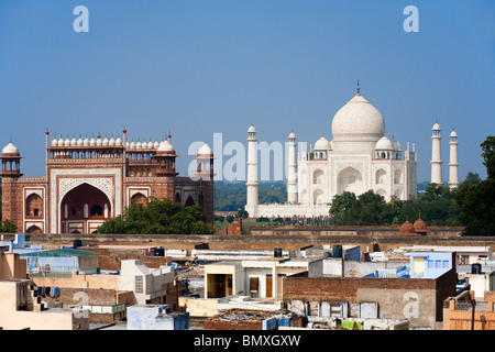 The Taj Mahal and the taj ganj neighborhood's rooftops are seen from a distance. Stock Photo