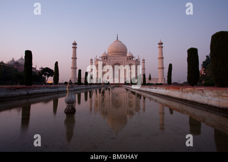A long exposure gives a ghostly appearance of an empty Taj Mahal at sundown. Stock Photo