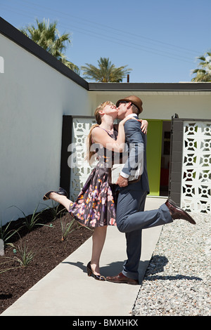 Retro couple outside home Stock Photo