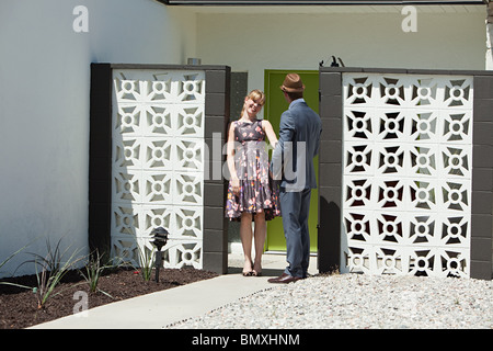 Retro couple outside home Stock Photo