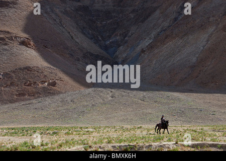 Tibetan man on horseback in Central Tibet Stock Photo