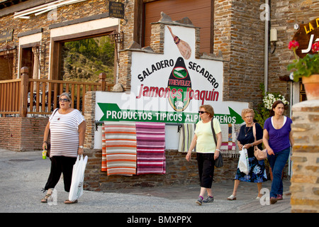 Shop advertising traditional Ham leg sales in Travelez La Alpujarra Granada Province, Andalusia, Spain Stock Photo