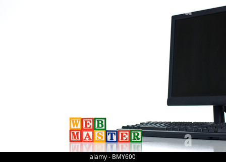 Colorful children's blocks spelling WEBMASTER with computer keyboard and monitor Stock Photo