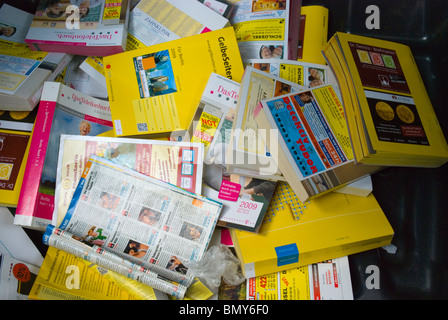 Yellow Pages telephone directory books in recycling bin Kreuzberg west Berlin Germany Europe Stock Photo