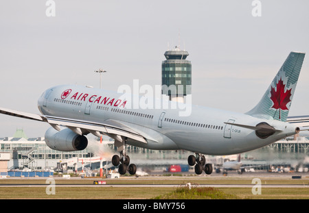 An Air Canada Airbus A330-300 jet airliner landing at Vancouver International Airport (YVR). Stock Photo