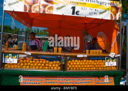 Freshly pressed orange juice stand Mauerpark flea market Mitte central Berlin Germany Eurore Stock Photo