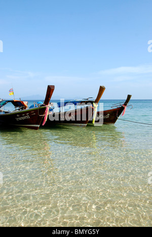 fishermen in long-tail boats ko bulone-leh island in the