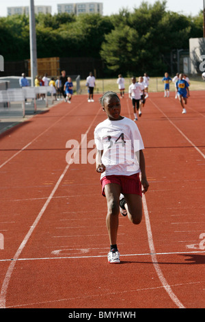 11-12 year olds compete in the Croydon primary schools' athletics championships at Croydon Arena Stock Photo