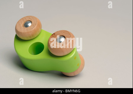 Toy wooden car upside down Stock Photo