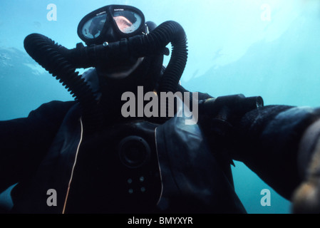 View looking up at a Navy SEAL combat swimmer. Stock Photo