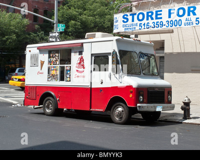 distinctive red & white Good Humor ice cream truck parked illegally next to a fire hydrant on west side Midtown Manhattan NYC Stock Photo