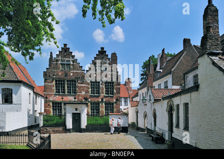 Tourists visiting the Saint Elisabeth Beguinage with its small houses built in the 17th century, Kortrijk, Belgium Stock Photo