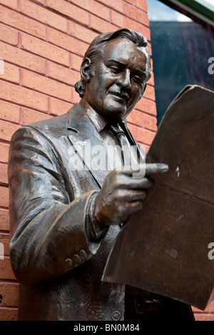Ybor City, Tampa, FL - July 2009 - Statue of man reading newspaper at Centro Ybor in downtown Ybor City area of Tampa, Florida Stock Photo