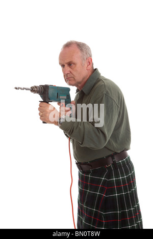 Mature Scotsman in a Mackenzie kilt using a power drill Stock Photo