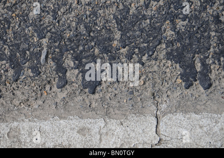 Closeup of really rough cracked rocky grunge asphalt background texture. Stock Photo