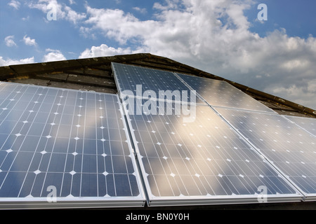 Solar Power. Photovoltaic cells on a domestic house roof in the UK Stock Photo