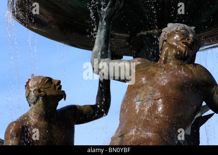 The triton fountain, Valletta, island of Malta. Water cascades from a bowl onto the heads of two figures representing Triton Stock Photo