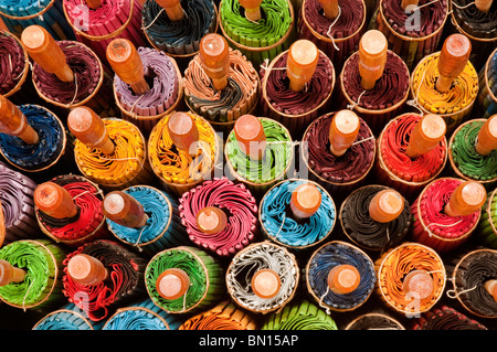 Rolled up umbrellas at The Umbrella Factory in Chiang Mai, Thailand. Stock Photo