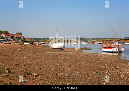 Boats beached at low tide at Burnham Overy Staithe, Norfolk, England, United Kingdom. Stock Photo
