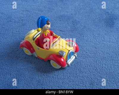 Plastic Toy Noddy Car on Carpeted Floor Stock Photo