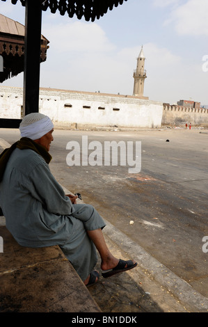 homeless muslim old man outside mosque near coptic cairo, egypt Stock Photo