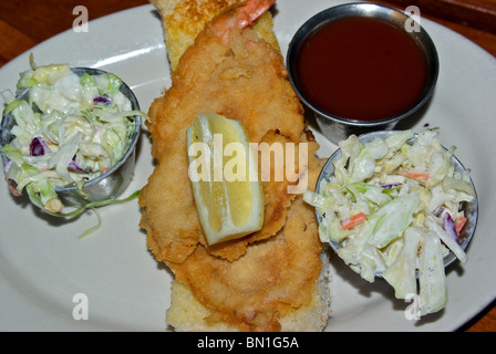 Small Herby K's Gulf Coast shrimp buster poor boy luncheon sandwich with cole slaw and tomato dipping sauce Stock Photo