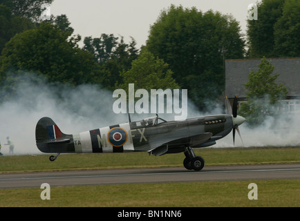 A Second world war Spitfire comes in to land at Biggin Hill Airport Kent in England Stock Photo