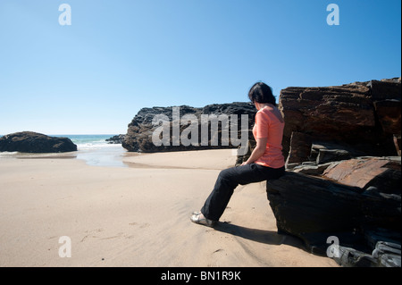Gwithian Beach, Cornwall, England: Women relaxing on the Gwithian beach in Cornwall Stock Photo
