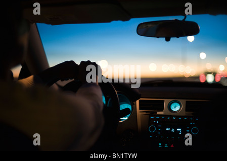 Driving at twilight Stock Photo