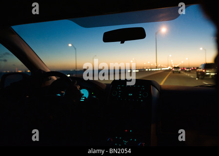 Driving at dusk Stock Photo