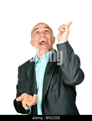 Portrait of laughing businessman pointing up isolated on white background Stock Photo