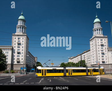 View of famous landmark towers and tram at Frankfurter Tor on Karl Marx Allee in former east Berlin in Germany Stock Photo
