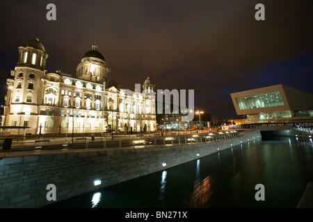 City of Liverpool, England. Night view of the Leeds and Liverpool canal link at Liverpool’s Pier Head waterfront. Stock Photo