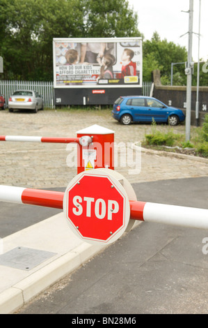 Automatic barrier with a STOP sign Stock Photo - Alamy