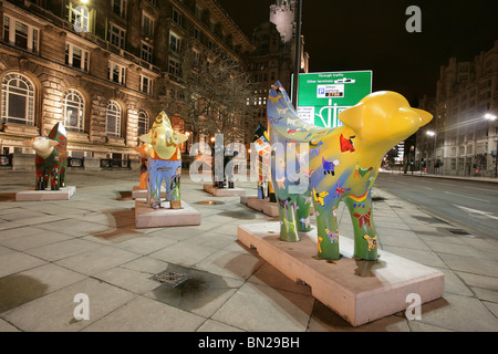 City of Liverpool, England. Night view of a collection of Superlambanana’s next to Liverpool’s Strand dual carriageway. Stock Photo