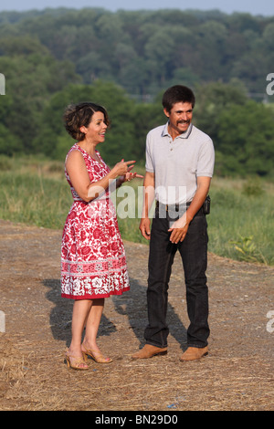 Hispanic couple in the summer talking and laughing Stock Photo