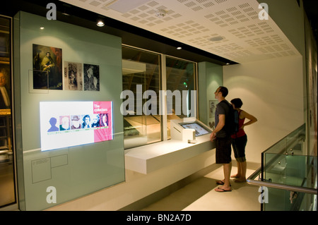 People looking at displays within the Darwin Centre cocoon in the Natural History Museum, London UK Stock Photo