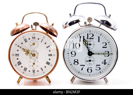 Chrome and cooper alarm clock front view over white background Stock Photo