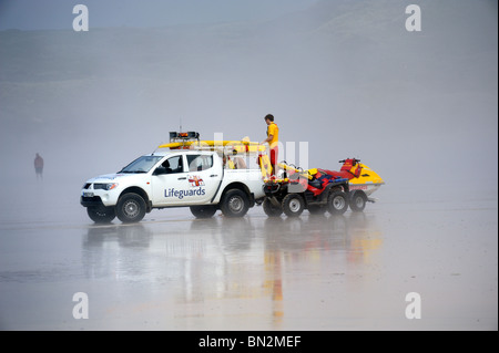 Lifeguards on duty on a foggy beach Stock Photo