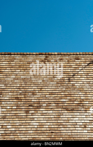 Cedar shingles on a roof. Wooden roofing tiles Stock Photo